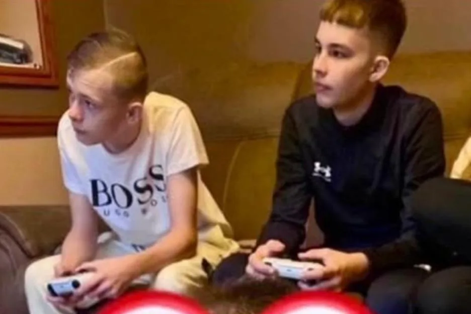 Mason Rist and Max Dixon playing on a games console together.