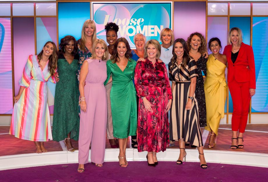 A group of women, including Stacey Solomon, Kelle Bryan, Penny Lancaster, Brenda Edwards, Denise Welch, Jane Moore, Nadia Sawalha, Saira Khan, Carol McGiffin, Kaye Adams, Andrea McLean, Ruth Langsford and Christine Lampard, standing on stage for the "Loose Women" TV show.