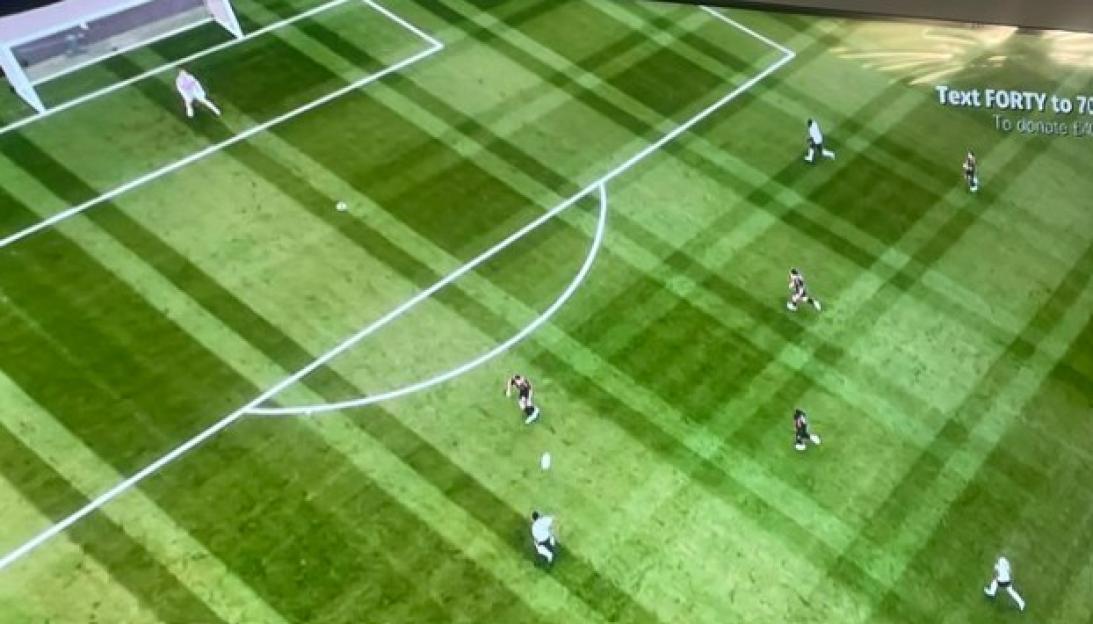 Illustration of a soccer field with players, goal, and the ball.