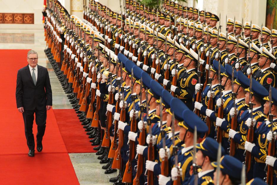 Britain's Prime Minister Keir Starmer inspects a Chinese honour guard during a welcome ceremony in Beijing.