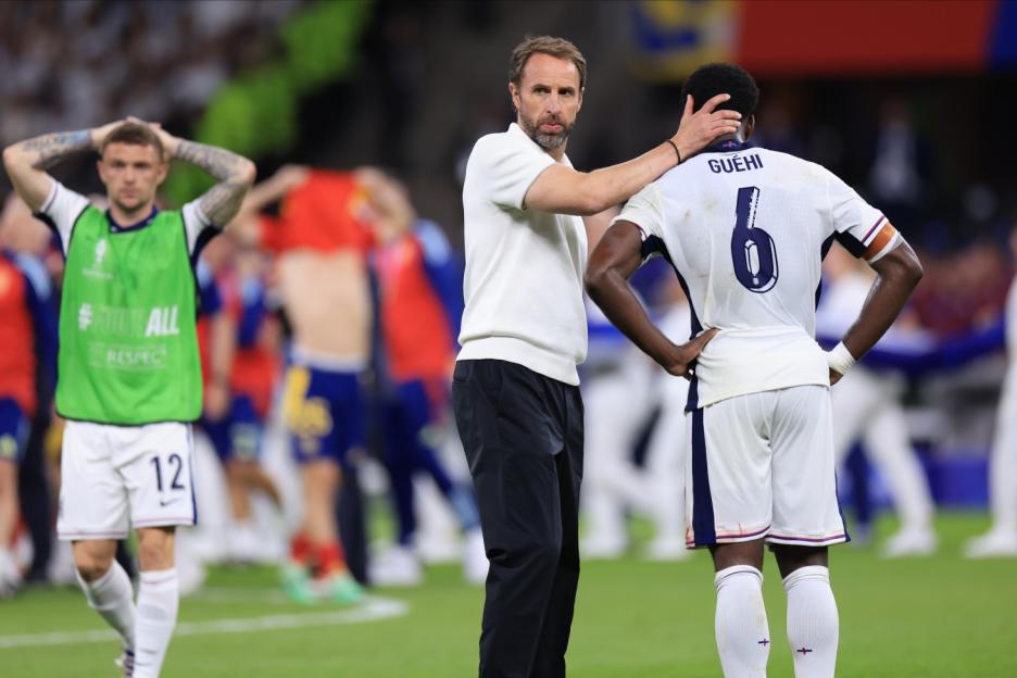 England manager Gareth Southgate consoles player Marc Guéhi after the UEFA EURO 2024 Final match against Spain.