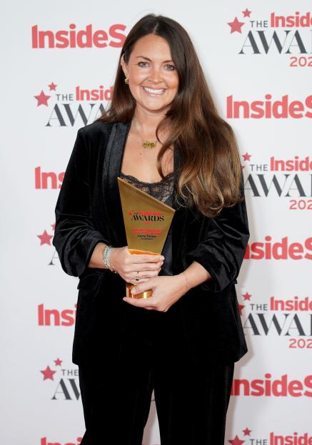 Lacey Turner holding her "All-Time Icon" award at the Inside Soap Awards.