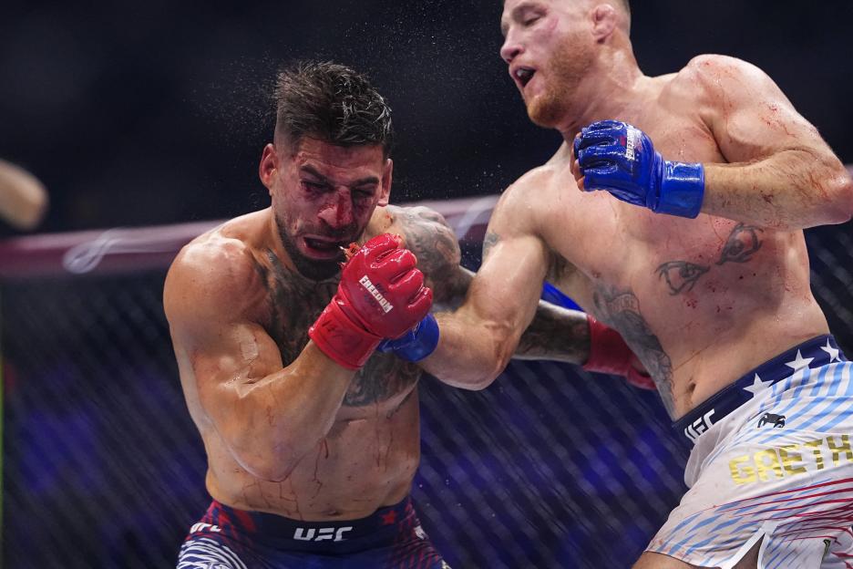 Justin Gaethje strikes Ilia Topuria during the UFC Freedom 250 event.