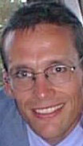 Andrew Pleming smiling.