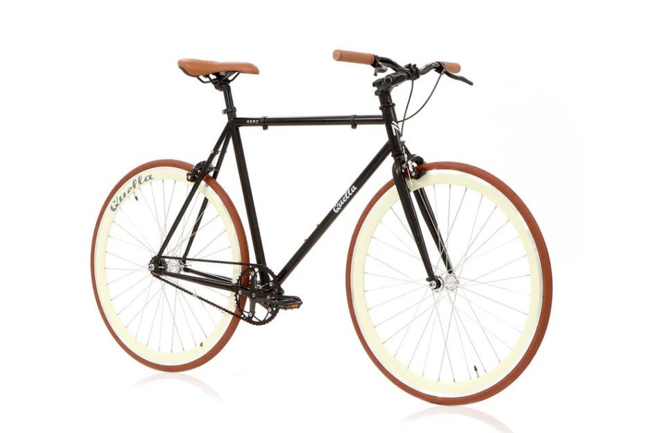 Black "Quella" bicycle with light-colored tires and brown trim, seat, and handlebars.