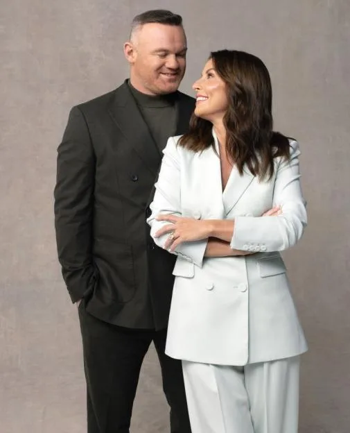 Wayne and Coleen Rooney pose together in a studio.