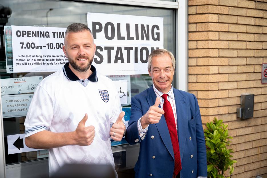 Makerfield, UK. 18 June 2026. Reform UK leader Nigel Farage with Reform?s Makerfield by-election candidate Rob Kenyon. Farage joined their party?s candidate as he voted at St Aidan?s Parish Centre polling station, Winstanley. Credit: Benjamin Wareing