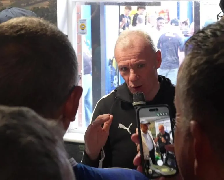 Iconic EFL boss, 63, belts out KARAOKE with fans in local pub after record-breaking win