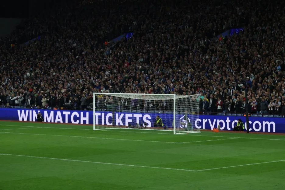 A stadium filled with spectators watching the UEFA Champions League quarter-final match between Aston Villa FC and Paris Saint-Germain.