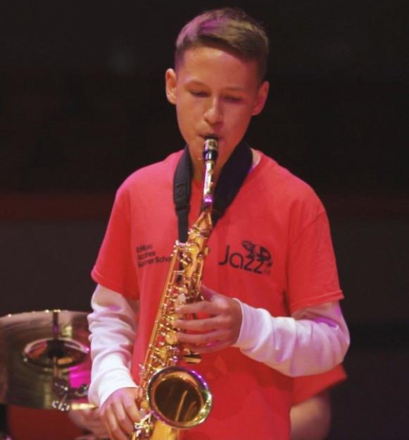 Louis Watkiss playing the saxophone.
