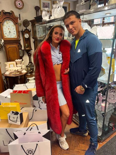 Venezuela Fury and her fiancé Noah Price, surrounded by shopping bags.