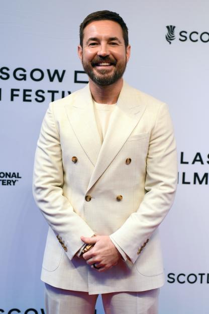 Martin Compston smiling at the "Fear" Premiere at Glasgow Film Festival.