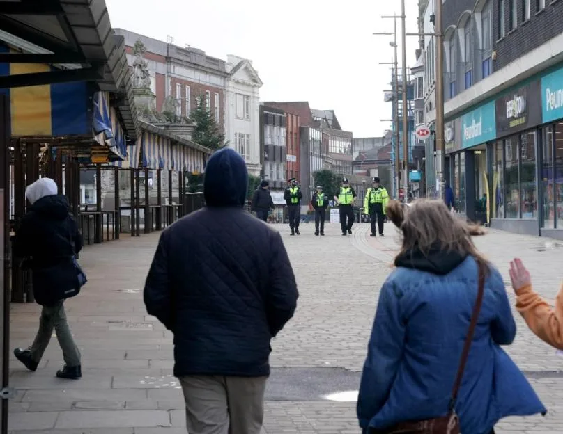 Police officers on patrol in the pedestrianized shopping street of Dudley.