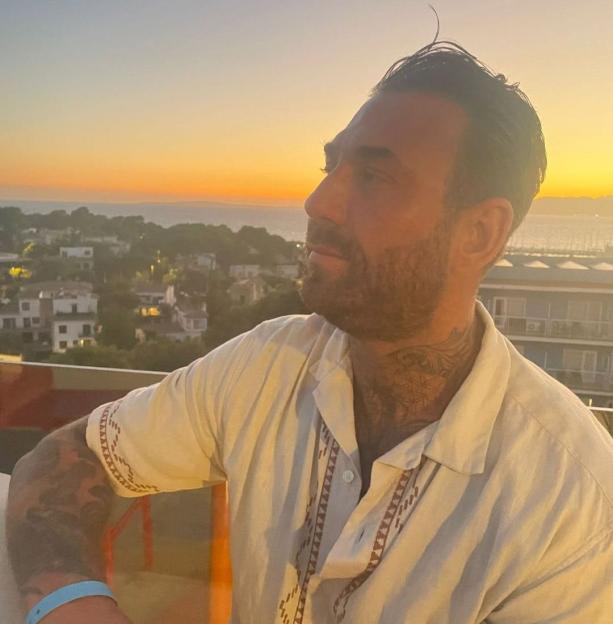 Westley O'Bryan on a balcony at sunset.