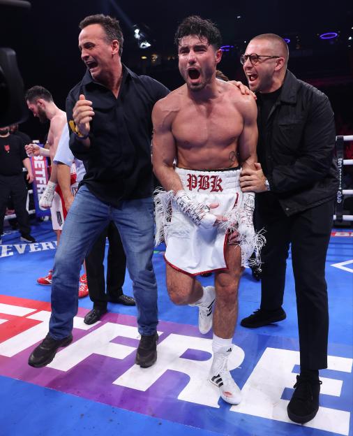 Josh Kelly celebrates beating Bakhram Murtazaliev after their IBF World Super Welterweight Title fight.