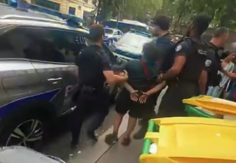Police arresting a 14-year-old boy.