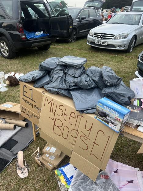 Mystery bags for sale at a car boot sale.