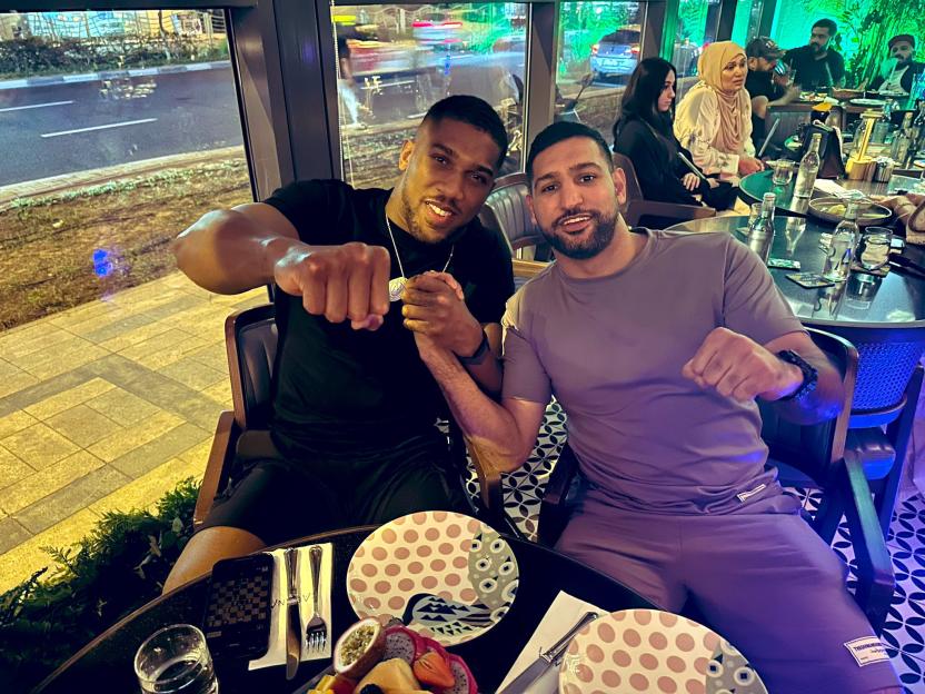 Anthony Joshua and Amir Khan together at a restaurant.