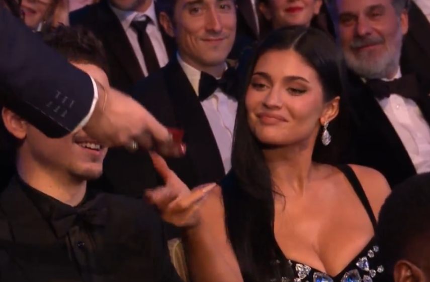 Kylie Jenner and Timothée Chalamet sitting together at an awards ceremony.