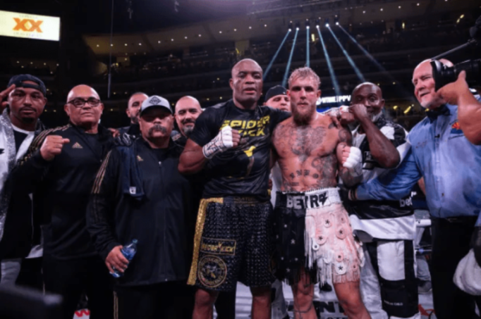 a man wearing a shirt that says ' spider ' on it