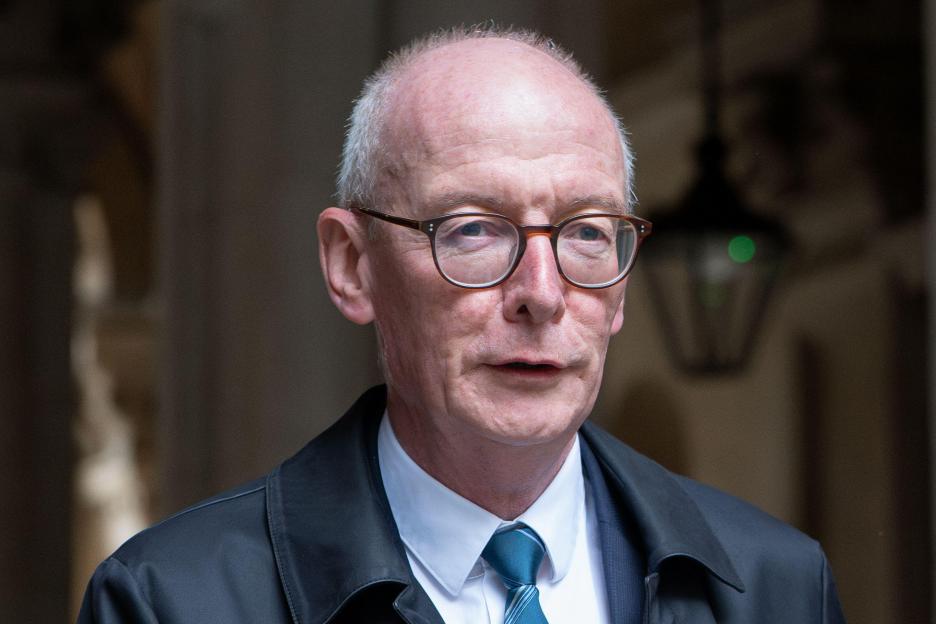 Pat McFadden, Secretary of State for Work and Pensions, in a suit and tie.