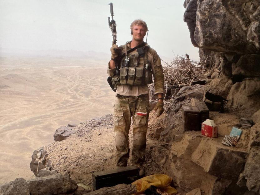 Al Carns wearing combat gear and holding a rifle in Afghanistan in 2010.