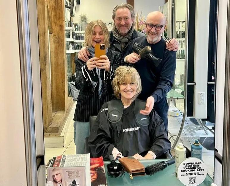 A group selfie of four people in a Toni&Guy salon.