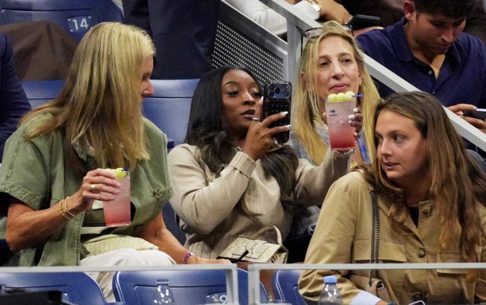 People watching the U.S. Open with drinks.