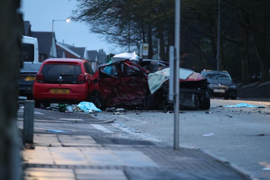 Police and emergency crews at the scene of a horrific car crash