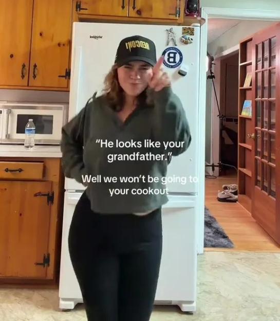 A woman in a black baseball cap and gray hoodie points her finger, with text that reads: "He looks like your grandfather." and "Well we won't be going to your cookout."