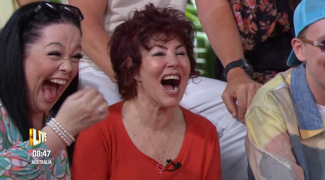 Ruby Wax and another person laugh with open mouths.