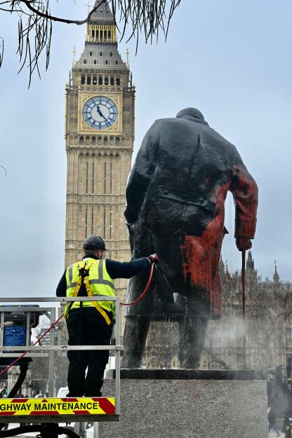 London, UK. A workman cleans the statue of Churchill in Parliament Square after it was defaced by a Free Palestine activist. A man has been arrested for spraying the statue with the slogan "Zionist war criminal." Credit: michael melia/Alamy Live News