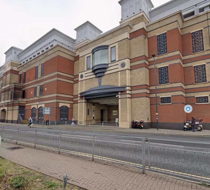 Exterior of a large brick building with the entrance marked 'St George's.'