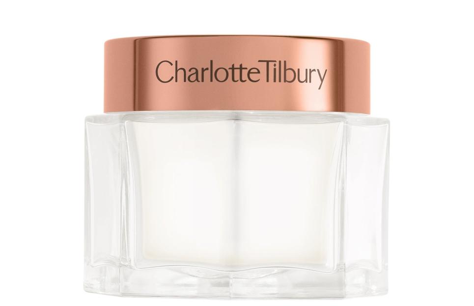 A clear Charlotte Tilbury cream jar with a rose gold lid.
