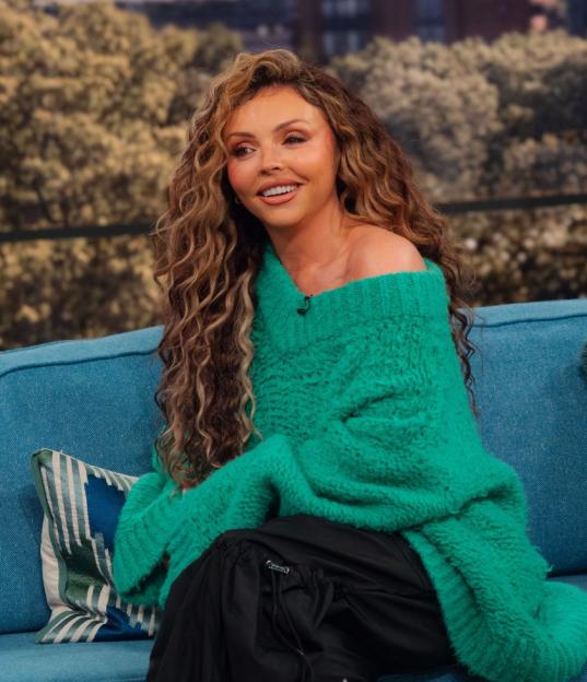 Jesy Nelson wearing a green sweater on the "This Morning" TV show.