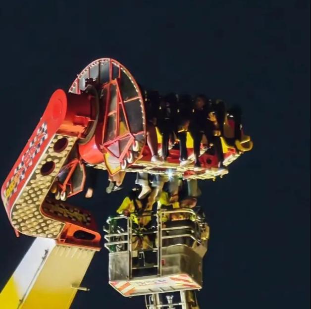VIDEO: Thrill seekers spend FOUR HOURS dangling 100ft in air after ride malfunctions
