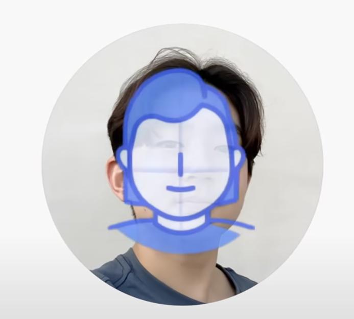 A person's face obscured by a blue and white illustration of a generic face, implying identity masking or anonymization.