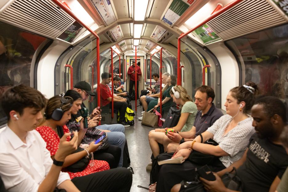Commuters on a crowded Central Line underground train in London during a heat wave.