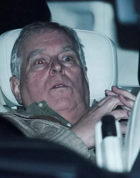 Andrew Mountbatten Windsor sitting in the back of a vehicle after leaving Aylsham Police Station.