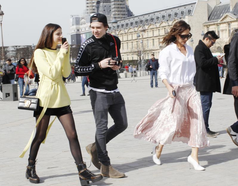 Victoria Beckham, Brooklyn Beckham, and Sonia Ben Ammar visiting The Louvre Museum in Paris.