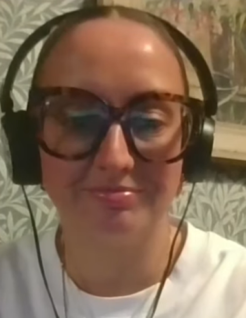 Sophie wearing oversized glasses and headphones.