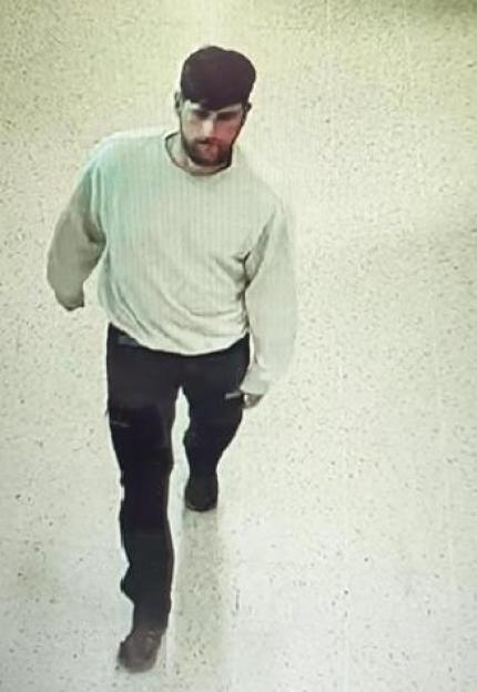 CCTV still of Sgt Alex Cairnie walking through a Tesco.