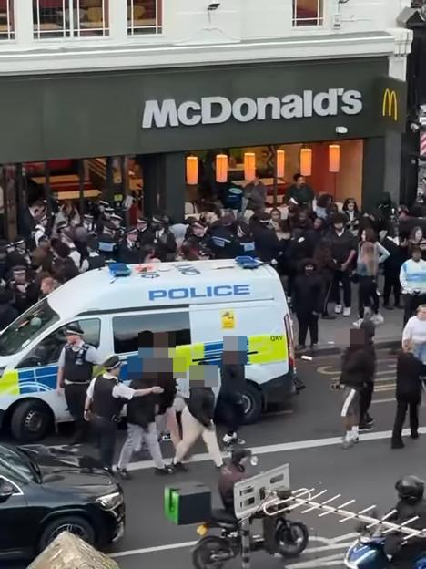 Police responding to a disturbance outside a McDonald's in Clapham.