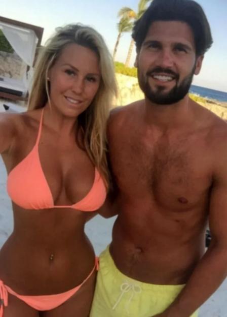 Couple in swimwear on a beach.