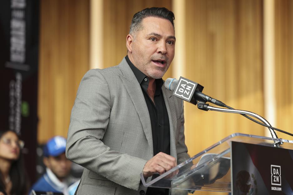 Oscar De La Hoya speaking at a press conference.