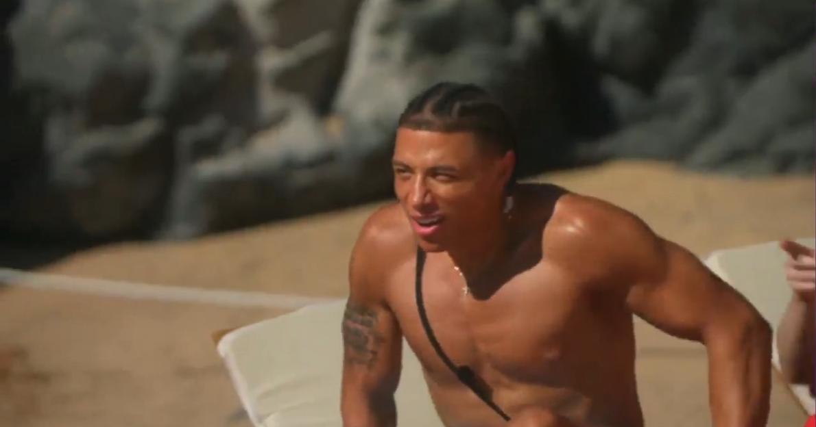 Chase from Ex On The Beach spitting out his drink in surprise.