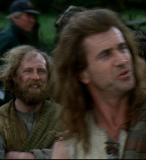 A group of men and a woman in medieval clothing.