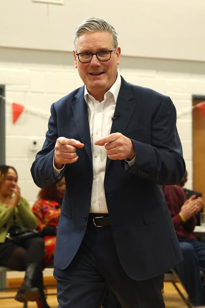 Prime Minister Keir Starmer speaking with residents at Newton Leys pavilion.