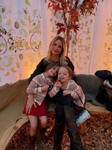 Woman with two young children.