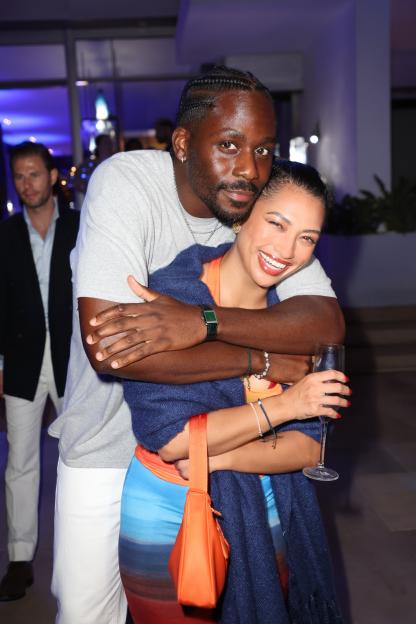 Emmanuel Lawal and Vanessa White embracing at the GREY GOOSE Altius launch party in Ibiza.